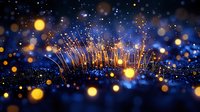 Glowing magical light strands rise against dark blue background with golden bokeh particles creating dreamy atmospheric effect. Suitable for fantasy designs.