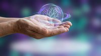 Male hands holding glowing holographic brain with neural networks on colorful bokeh background for medical technology and neuroscience concepts.