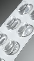 Clear transparent pills in blister pack on white background. Medical pharmaceutical capsules for healthcare and treatment concepts.