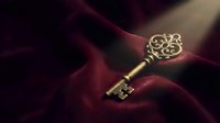 Ornate vintage brass key with decorative scrollwork resting on luxurious burgundy velvet fabric creating elegant antique atmosphere for mystery concepts.