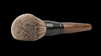 Makeup brush with natural bristles, black ferrule, and wooden handle isolated on transparent background. Ready for design use on t-shirts, clipart, stickers, and print-on-demand products.