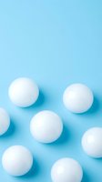 White spheres arranged on light blue background with shadows, suitable for minimalist design, advertising, and creative projects.