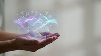 Hands holding glowing digital network connections with purple and blue light effects representing technology innovation and data transfer concepts.
