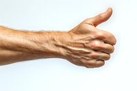 Male hand showing thumbs up gesture against white background, close-up view of skin texture and tendons visible, expressing positive approval or agreement.