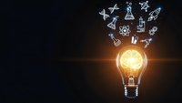 Glowing light bulb with scientific icons floating above on dark background representing innovation, research and creative thinking in science and technology.