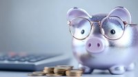 Pink piggy bank wearing round glasses with calculator and coins for financial planning and savings goals.