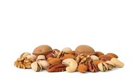 Mixed nuts collection with almonds walnuts cashews pecans and pistachios isolated on white background for healthy snacking and cooking ingredients.