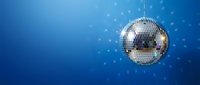 Sparkling disco ball with light reflections on blue background for party and nightclub entertainment events.