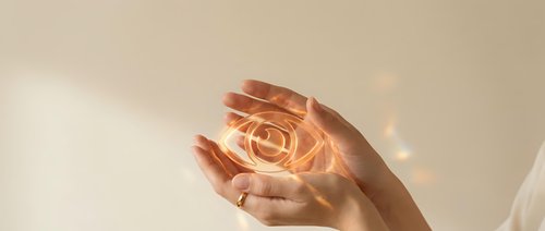 Hands holding glowing light bulb against warm beige background, symbolizing innovation, ideas, energy efficiency, and sustainable solutions for business and technology concepts.