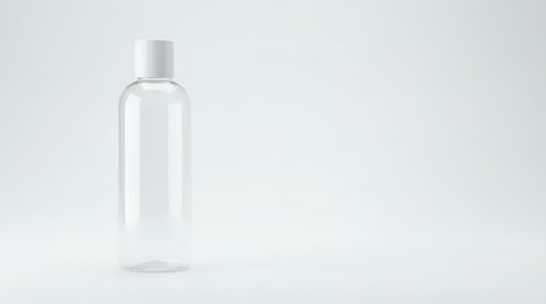 Clear plastic bottle with white cap isolated on white background for cosmetic packaging and product design mockups.