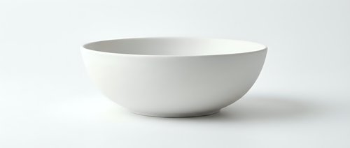 White ceramic bowl isolated on white background, minimalist tableware for kitchen and dining concepts, clean matte finish porcelain dishware.