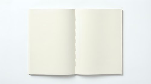 Open blank cream colored notebook or journal with two pages spread flat on white background, ready for writing or design mockup purposes.