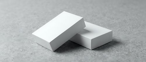 Two blank white business cards stacked on a gray textured surface, mockup template for branding and corporate identity design presentation.