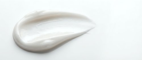 White cream smear isolated on transparent background for skincare cosmetic product design and beauty advertising applications.