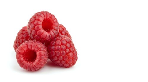 Fresh red raspberries isolated on white background for healthy eating, cooking recipes, organic food concepts and natural ingredient designs.