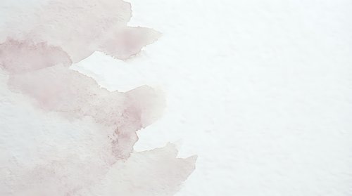 Soft pink watercolor texture with organic flowing shapes on white paper background for artistic projects and creative designs.