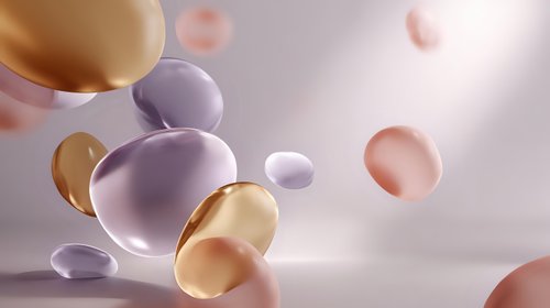 Smooth pastel spheres in gold, lavender, and pink floating against soft white background, creating elegant abstract composition for cosmetic or luxury branding.
