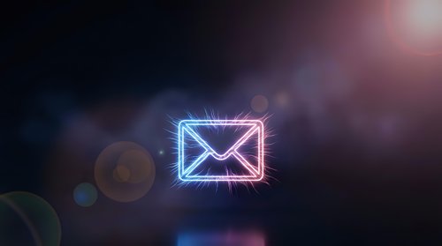 Glowing neon email envelope icon with bright light rays and lens flare effects on dark background for digital communication concepts.