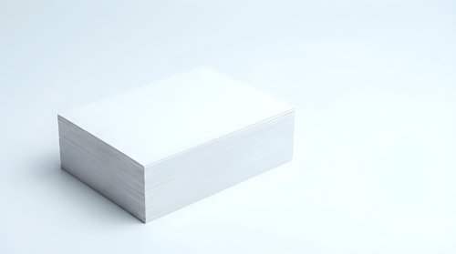 White blank paper stack corner view on light background for office supplies and printing materials.