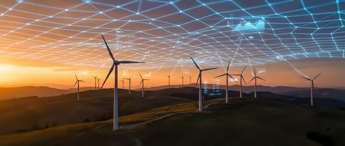 Wind turbines generating renewable energy at sunset with digital grid overlay representing smart technology and sustainable power infrastructure.