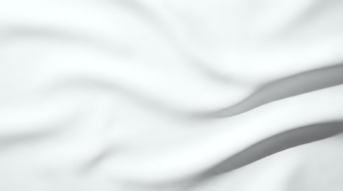 Abstract white flowing fabric waves with soft shadows creating elegant minimalist background for luxury branding and modern design projects.