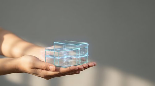 Transparent glass cube structure floating above open palm showcasing modern technology concept for business presentations and digital innovation projects.