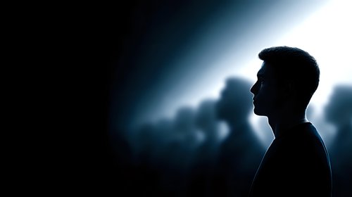 Male silhouette profile against bright light background with dramatic lighting effects for business presentations and motivational content.