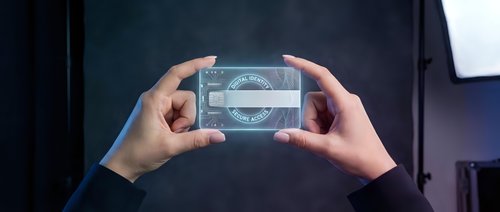 Businessman hands holding transparent futuristic holographic interface with digital data visualization and analytics dashboard for modern technology presentation.