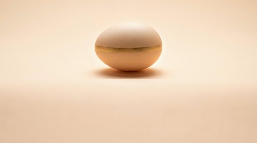 Smooth beige oval stone on neutral background for zen meditation wellness spa relaxation mindfulness balance harmony peaceful minimalist design.
