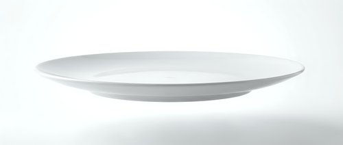 Empty white ceramic plate isolated on white background for food presentation and culinary design projects.
