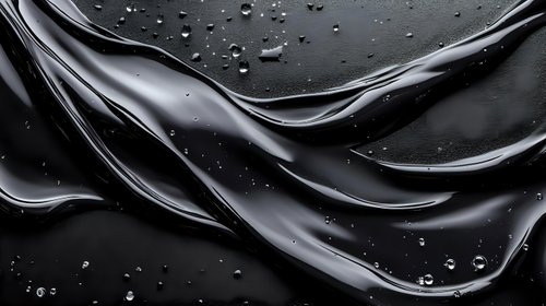 Glossy black liquid waves with water droplets on dark surface creating elegant flowing motion for luxury cosmetics and skincare product backgrounds.