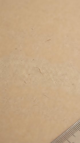 Smooth golden sand texture with fine grains and natural patterns for beach vacation backgrounds and summer design projects.