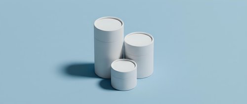 White cylindrical geometric shapes on light blue background for modern minimalist design projects and presentations.