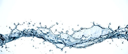 Dynamic water splash with flowing liquid motion and droplets against clean white background for refreshing beverage and hydration concepts.