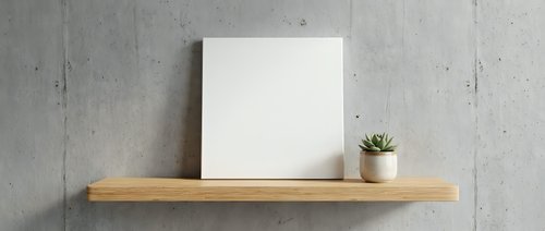 Blank white canvas and small succulent plant on wooden floating shelf against concrete wall for modern minimalist home decor and interior design mockup.