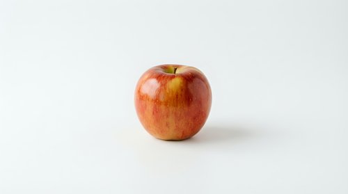 Fresh red apple with natural striations isolated on white background, suitable for food packaging, nutrition labels, healthy eating campaigns, and culinary design projects.