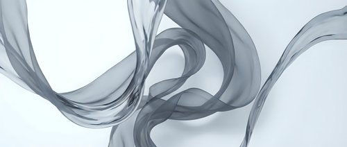 Elegant gray smoke swirls creating fluid abstract patterns on white background for modern design projects and creative compositions.
