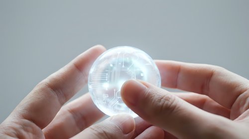 Hands holding transparent sphere with digital holographic interface and data visualization for technology, innovation, and future business concepts.