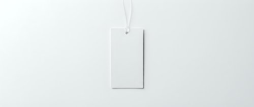 Blank white rectangular tag hanging from string against clean white background for branding mockup and product presentation design projects.
