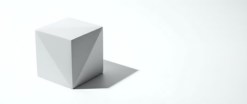 White geometric cube with shadow on clean background for minimalist design projects and modern presentations.