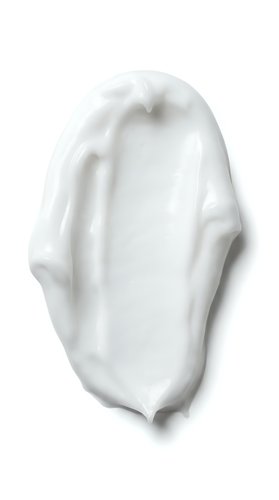 Isolated white cream or lotion smear with smooth texture on transparent background, suitable for cosmetics, skincare, and beauty product design applications.