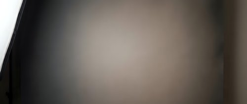 Dark abstract blurred background with soft gradient transition from black to beige, suitable for overlay designs, web backgrounds, and minimalist compositions.