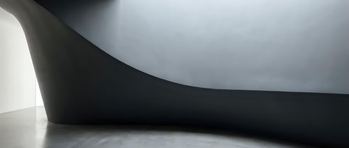 Modern minimalist interior with curved concrete walls and dramatic lighting creating abstract architectural shadows and geometric forms.