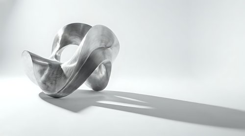 Abstract metallic ribbon sculpture with flowing curves casting dramatic shadow on white background for modern design projects.