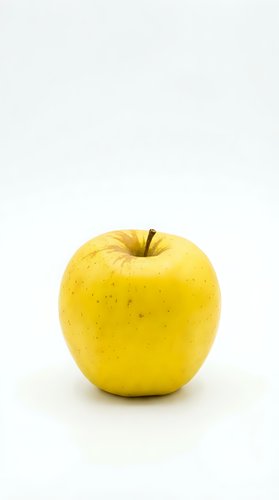 Fresh yellow apple isolated on white background for healthy eating and nutrition concepts.