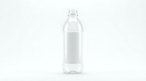 Clear plastic water bottle with blank white label isolated on white background for product mockup and branding design projects.