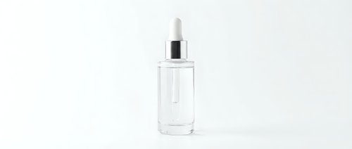 Clear glass dropper bottle with white pipette cap isolated on white background for skincare serum cosmetic product packaging design.