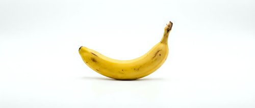 Single ripe yellow banana isolated on white background, ready for design use in food, nutrition, and healthy eating projects.