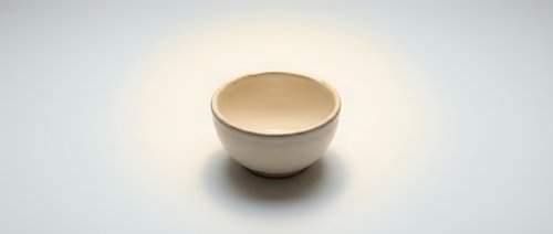 Empty ceramic bowl on white background isolated for kitchen design and culinary projects.