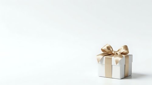 White gift box with gold ribbon bow isolated on white background, ready for holiday, birthday, and celebration design projects.